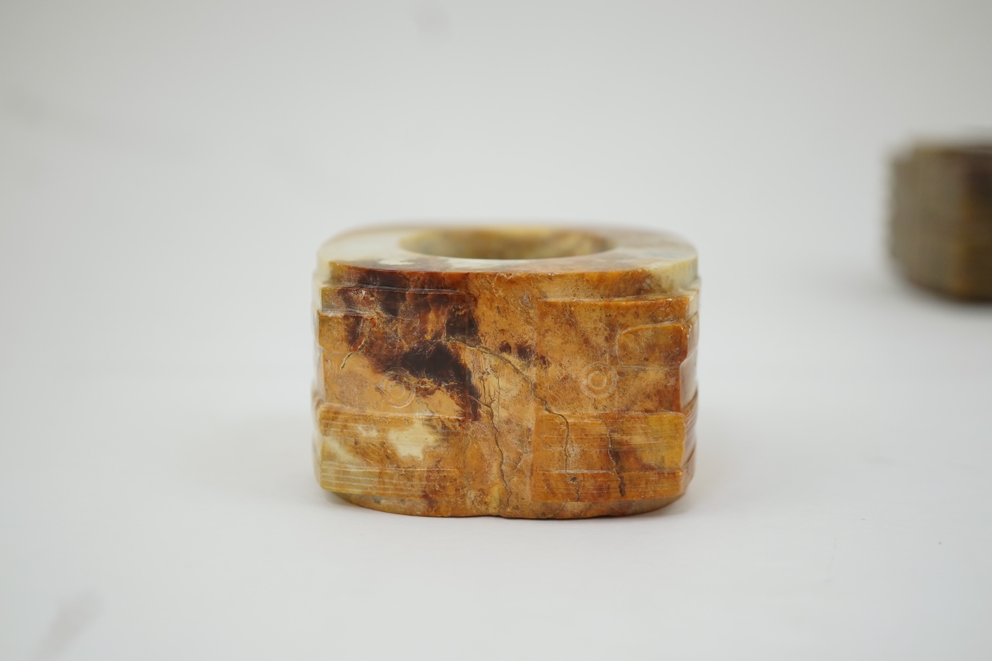 Four Chinese archaistic hardstone or burnt jade cong or cylinders